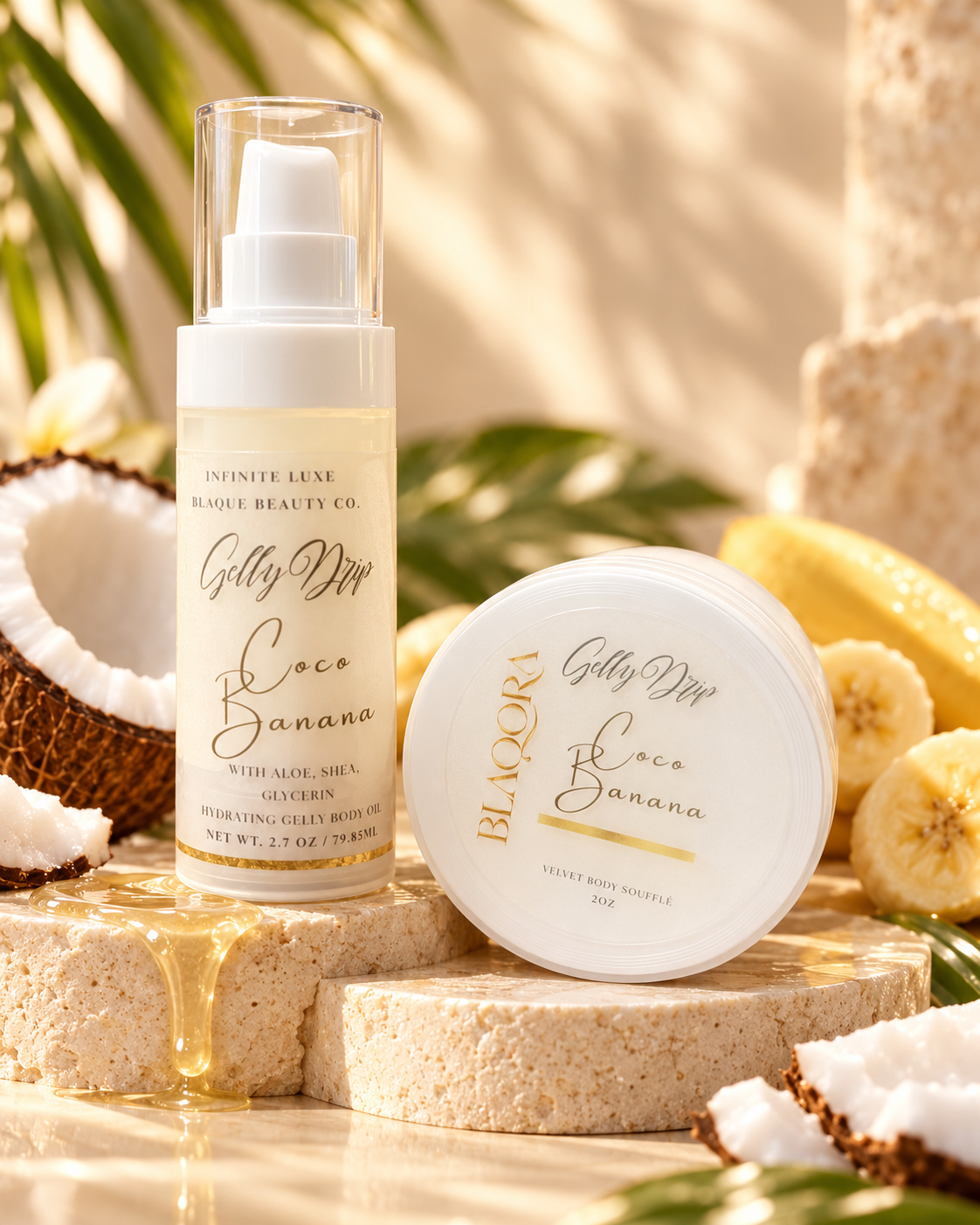 A skincare set from Infinite Luxe Blacore Beauty Co. featuring a 'Gelly Dior Coco Banana' moisturizing gel body wrap bottle and a matching 'Gelly Dior Coco Banana' treat body butter jar, styled on natural stone blocks with coconut halves, sliced bananas, and palm leaves in a warm, tropical setting.