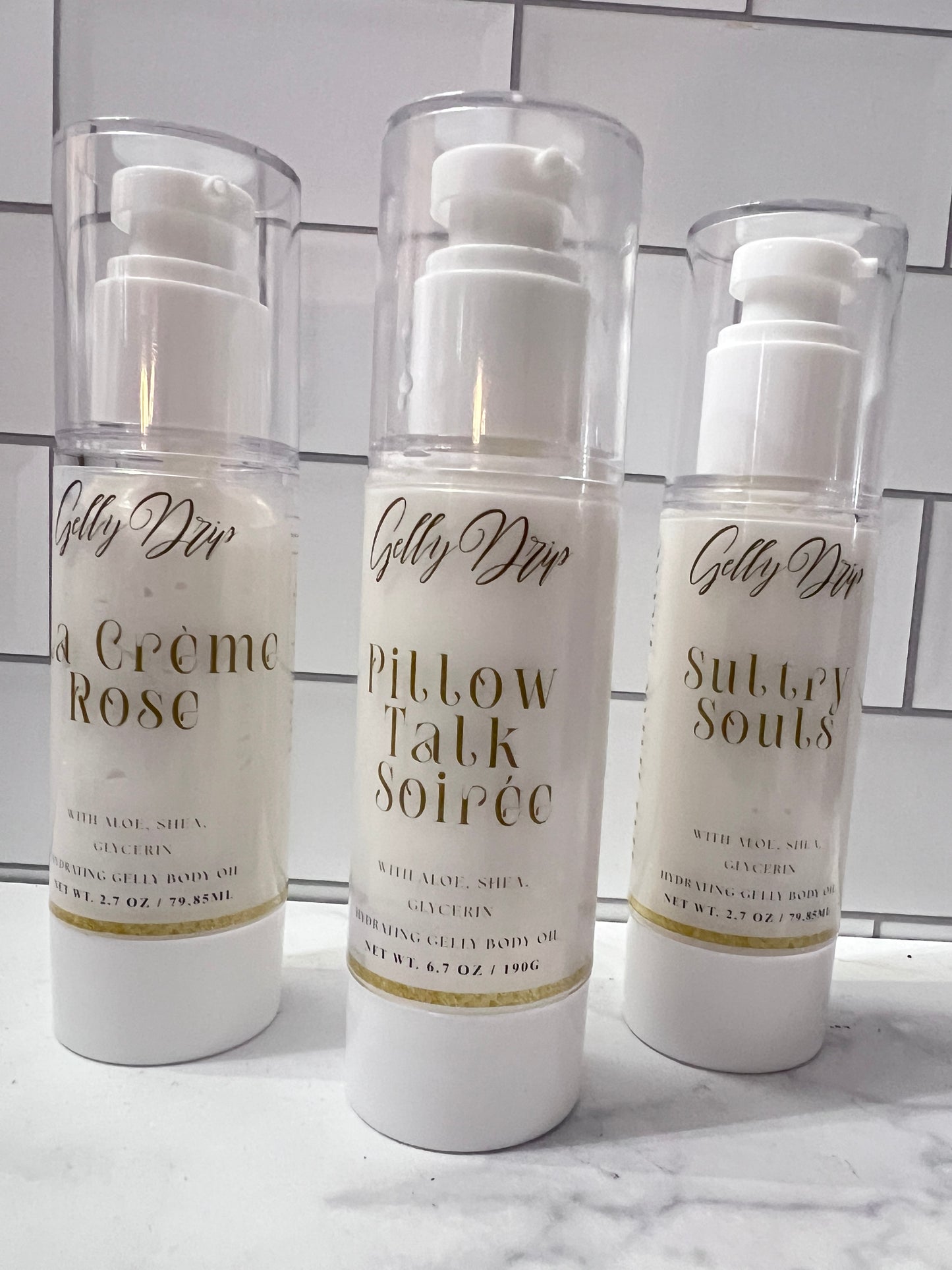 Three skincare bottles with visible text on a tiled wall background