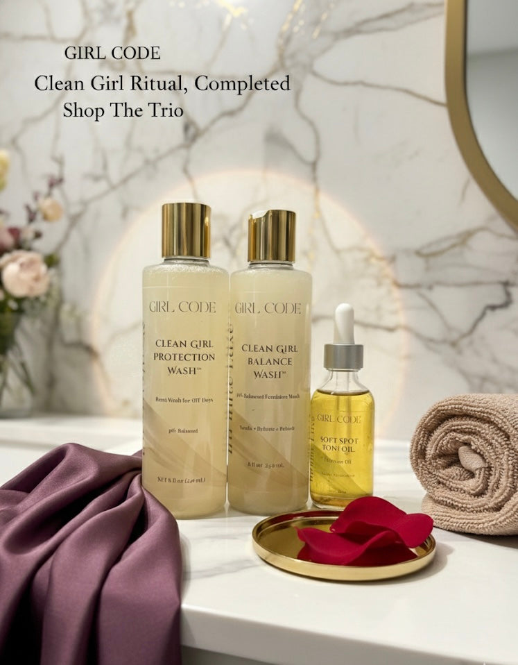 Girl Code skincare products on a bathroom counter with decorative elements.